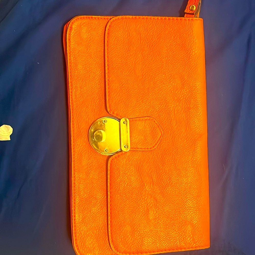 Orange leather clutch with wristlet